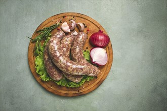 Raw kupaty, traditional Georgian sausages, raw sausages, with spices and herbs, Georgian cuisine