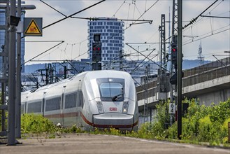 Deutsche Bahn ICE train passing through Zuffenhausen station, overhead lines, railway system and