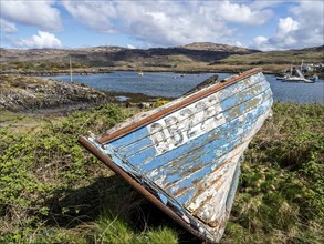 Ulva isle, boat on the shore, view to Isle of Mull, Ulva, Scotland, UK