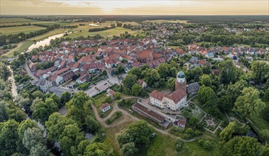 Panorama aerial view of village Lenzen and river Loecknitz (Löcknitz) at sunset, Brandenburg,