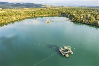 Aerial view of turquoise quarry pond of a gravel pit, Burkheim, Rhine valley, Germany, Europe