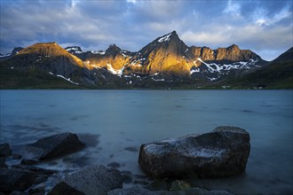 Landscape with sea and mountains on the Lofoten Islands, view over the fjord Flakstadpollen to the