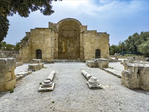 View of remains of ruins of Titus Basilica with front cornerstones of portal and recumbent columns