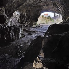 View from the Feldhof Cave in the Hönne Valley in Balve to Klusenstein Castle in Hemer, Märkisches