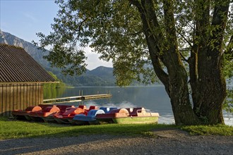 Pedal boats on the jetty in the evening light, boat hire, lakeside promenade of Kochel am See, Lake