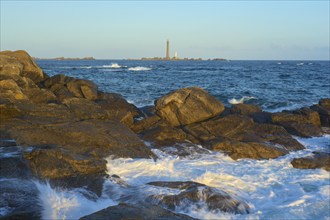 Lighthouse Phare I'Ile Vierge on the island llle Vierge, in the foreground a rocky coastal