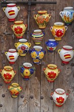 Traditional ceramics on an old wooden gate, Frigiliana, Andalusia, Spain, Europe