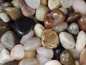 Tumbled, polished, coloured semi-precious stones, mineral stones, Idar-Oberstein,