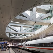 ICE at the centre platform with the large opening to the glass dome, long-distance train station,