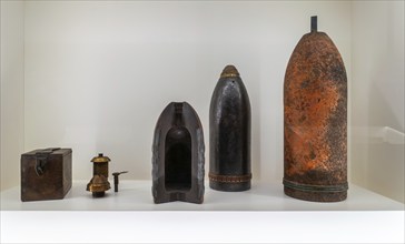 WW1 artillery shells, fuzes and sectioned projectile on display in museum at Fort van Liezele near