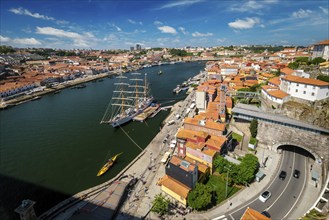 Aerial view of Porto city and Vila Nova de Gaia and Douro river with moored sailling ship from Dom