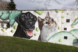 Portraits of dog and cat, realistically painted mural at an animal shelter, Duisburg, North