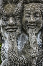 Temple figure, couple, woman, man, Hinduism, tongue, long, outstretched, facial expression, stone,