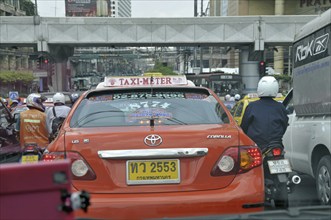 Motorbikes, mopeds and cars in traffic chaos, Ratchadamri Road, road traffic in Bangkok, Thailand,