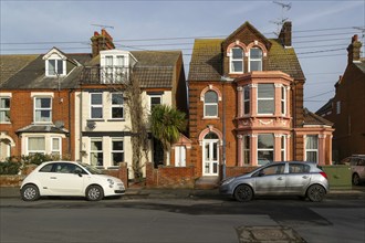 Edwardian houses residential property cars parked on street, town centre of Felixstowe, Suffolk,