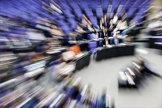 Zoom effect photo, Member of Parliament in the plenary hall of the German Bundestag, Berlin, 13