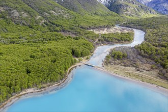 Aerial view of lake Lago Jeinimeni, river flowing out of the lake, glacial blue water in contrast