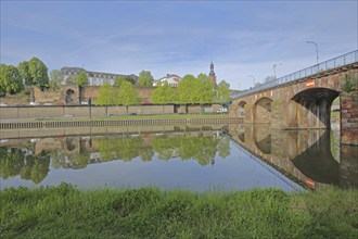 Old bridge built in 1549 over the Saar with castle, castle church and historic city fortifications,