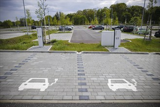 Symbolic photo. Parking spaces and charging points for electric cars are located in a newly built