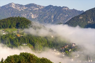 Morning fog over the village of Berchtesgaden in the valley, Bavaria, Germany, Europe