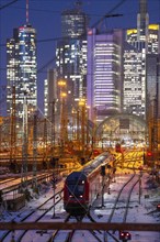 Railway tracks in front of the main railway station in Frankfurt am Main, skyline of skyscrapers in