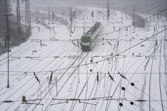 Onset of winter with lots of fresh snow and temperatures below -5 degrees during the day, railway