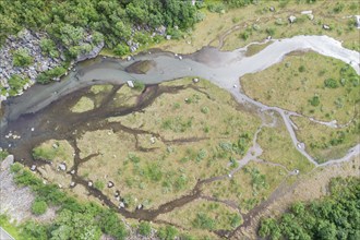 Aerial view of a small river along road Aursjovegen, a rural tourist route in the northern fjord