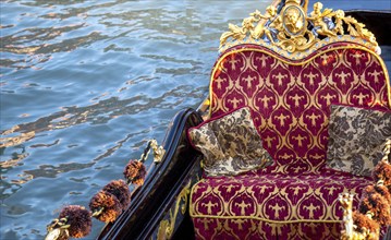 Luxury Gondola waiting for tourists near famous Rialto Bridge in Venice