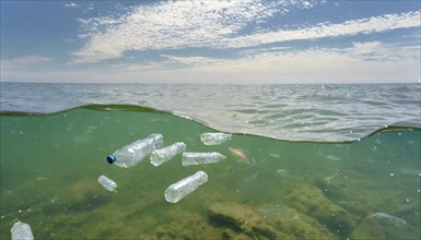 Symbolism, waste problem, empty plastic bottles floating on the sea, AI-generated, AI-generated, AI