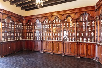 Old pharmacy with wooden shelves and antique vessels, Jerez