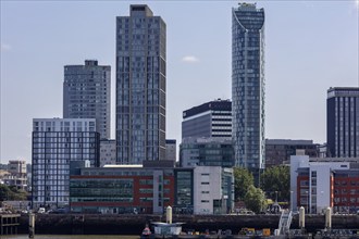 Modern skyscrapers and office buildings against a blue sky, part of the Liverpool skyline,