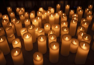 Sea of candles, many artificial, candles, candle flame, flame, electric, battery-operated, stand on