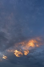 Evening sun breaking through the rain clouds (Nimbostratus), Mecklenburg-Vorpommern, Germany,