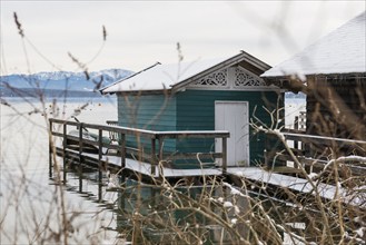 Boathouses with snow in winter, Tutzing, Lake Starnberg, Fünfseenland, Pfaffenwinkel, Upper