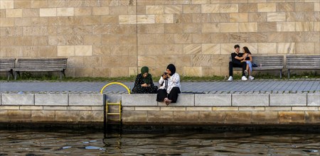 Passers-by on the banks of the Spree in Berlin's government district, Berlin, Germany, Europe