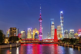 Shanghai skyline at the Bund with Oriental Pearl Tower city centre downtown at night in Shanghai,