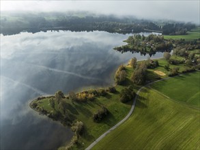 Sports facility and bathing area, lake Rottachsee, shore covered with fog, autumn, aerial view,