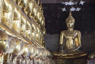 Golden Buddha statues, Bhumispara-mudra, Buddha Gautama at the moment of enlightenment, Wat Suthat