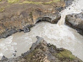 Aerial view of waterfall Aldeyarfoss, canyon of volcanic basalt columns, Iceland, Europe