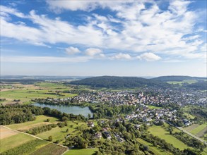 Aerial view of the municipality of Steißlingen with the natural bathing lake Steißlinger See,