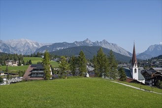 View of the village with St Oswald parish church, Karwendel mountains, view from the parish hill,