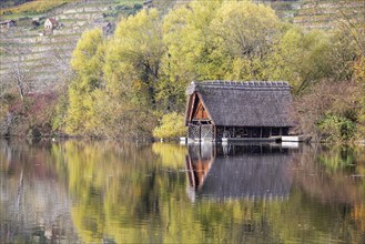 Boathouse at Max-Eyth-See in Stuttgart in autumn. The lake is an artificial lake directly on the