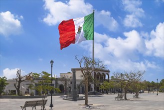 Los Cabos San Jose Del Cabo, Mexico, Mexican tricolor national striped flag proudly waving at mast,