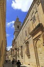 Historic buildings and Carmelite church and priory inside the medieval city of Mdina, Malta, Europe