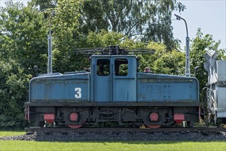 Vintage electric locomotive no. 3 from Krupp AEG with coal wagon for transporting lignite in