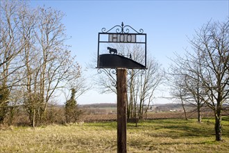 Sign showing horse and ploughman at the rural hamlet of Hoo, Suffolk, England, United Kingdom,