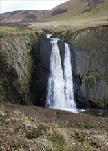 Speke's Mill Mouth waterfall as water cascades over steep cliff, near Hartland Quay, north Devon,