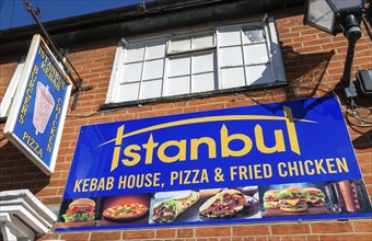 Istanbul kebab burgers pizza chicken, take-away restaurant signs, Halesworth, Suffolk, England, UK