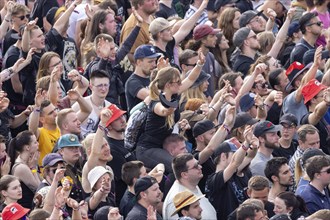 Adenau, Germany, 8 June 2024: Fans listen to the band Donots at Rock am Ring. The festival takes