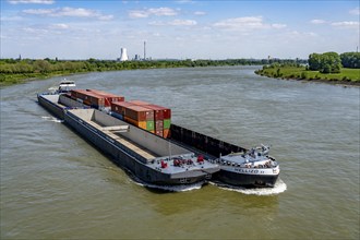 Cargo ship Mellizo, container freighter, only partly loaded, on the Rhine near Duisburg-Baerl, in